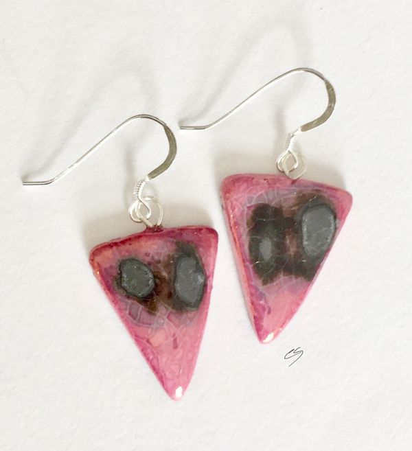 Pink triangle ceramic earrings with silver grey patterns.