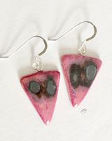 Pink triangle ceramic earrings with silver grey patterns.