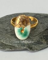 Porcelain ring with gold and green.