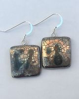 Square silver drop earrings.