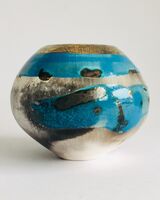 Blue smoke-fired ceramic pot with gold lustre.