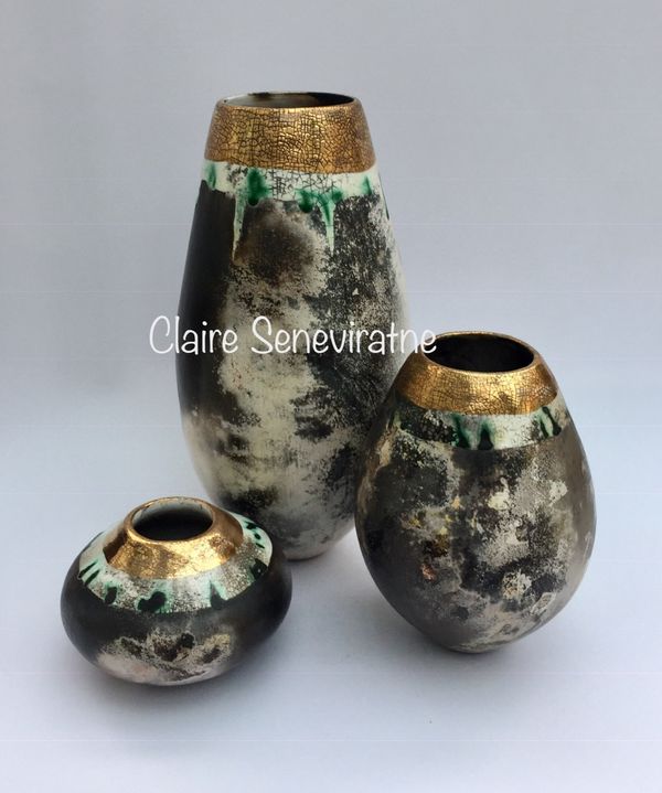 Group of 3 smoke fired pots.
