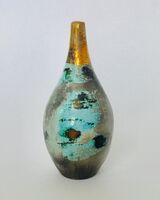 Small blue smoke-fired ceramic pot with gold lustre.