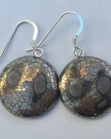 Silver round earrings with crackled glaze.