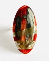 Large red ring with silver lustre.