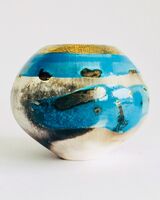 Blue smoke-fired ceramic pot with gold lustre.