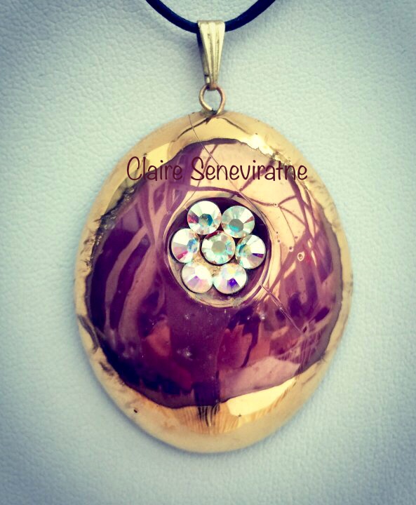 Gold and purple lustre pendant with swarovski crystals.