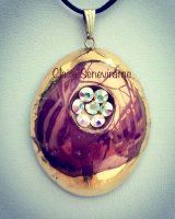 Gold and purple lustre pendant with swarovski crystals.