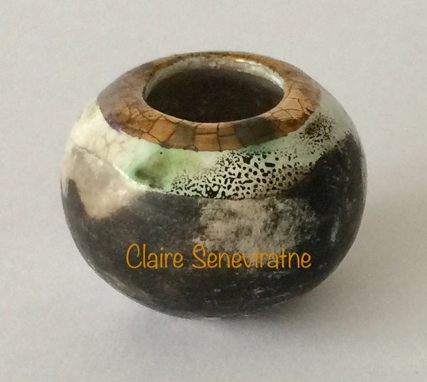 Tiny smoke fired pot.