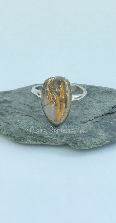 Porcelain ring with silver and gold.