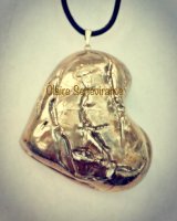 Large gold heart pendant.