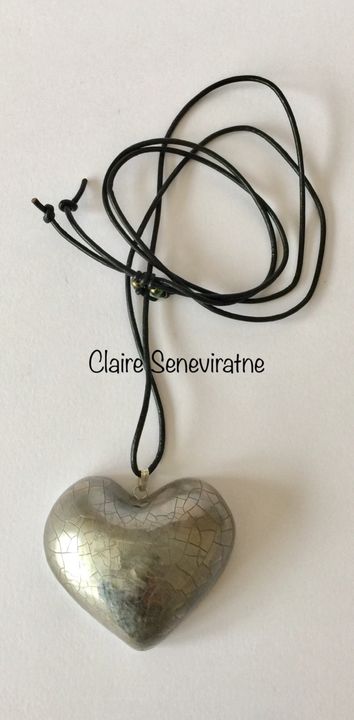 large silver heart pendant.
