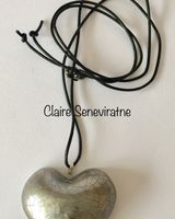 large silver heart pendant.
