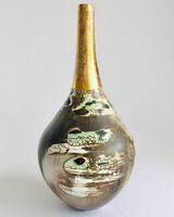 Ceramic pot, smoke-fired, with a long gold lustre neck.