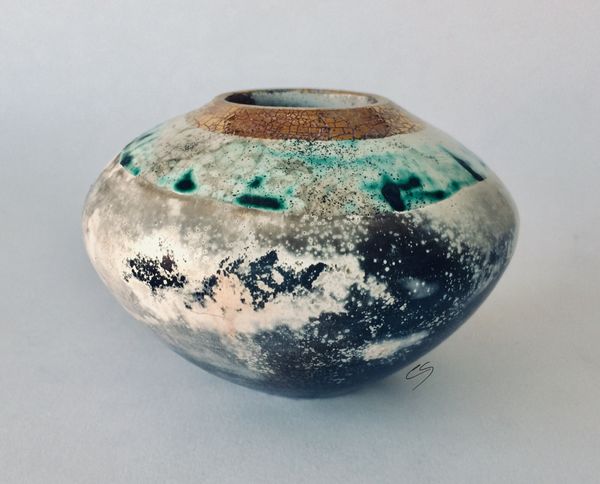 Round smoke fired pot with gold.