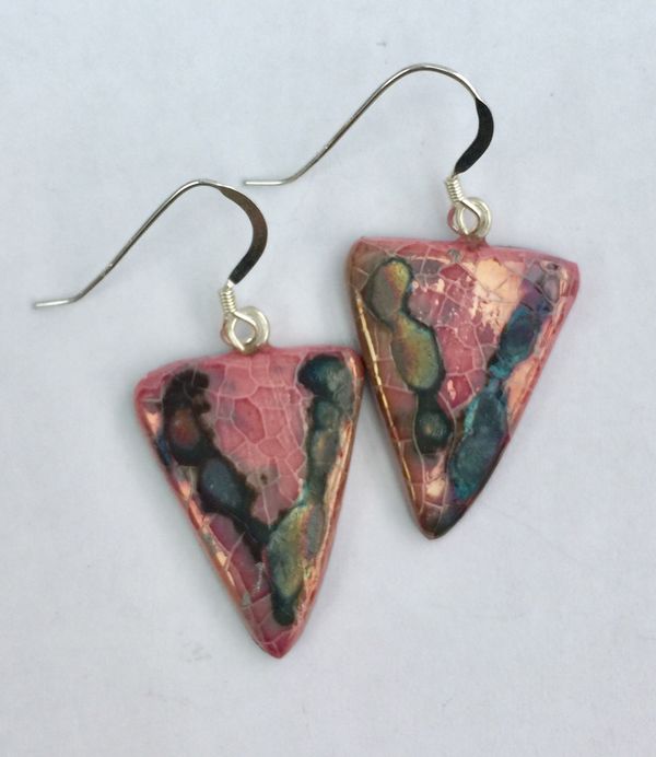 Pink triangle drop earrings with iridescent colours.