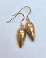 Gold ceramic teardrop earrings.