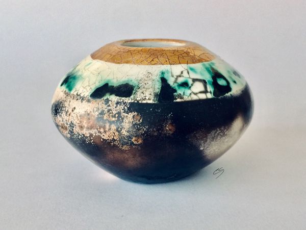 Smoke fired pot with gold.