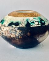 Smoke fired pot with gold.