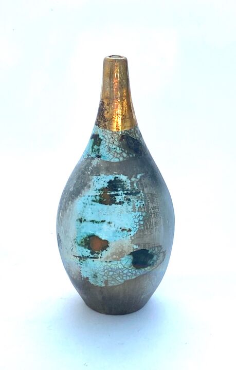 Small blue smoke-fired ceramic pot with gold lustre.