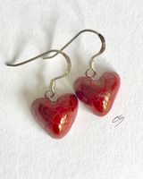 Red lustre heart drop earrings.