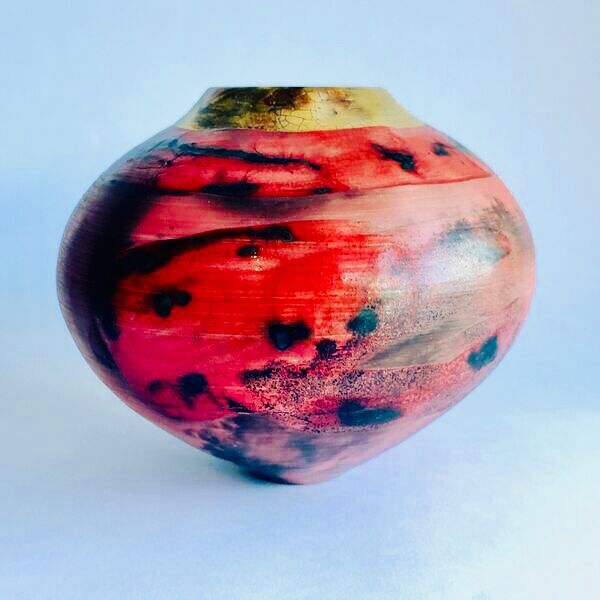 red smoke-fired pot with gold lustre.