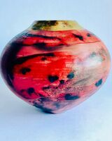 red smoke-fired pot with gold lustre.