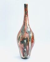 Tall red and gold glazed ceramic pot with long neck, smoke-fired in sawdust.