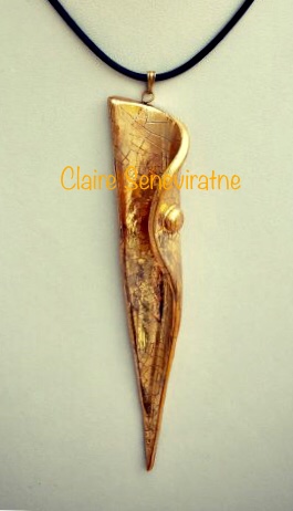 Gold lustre pendant.