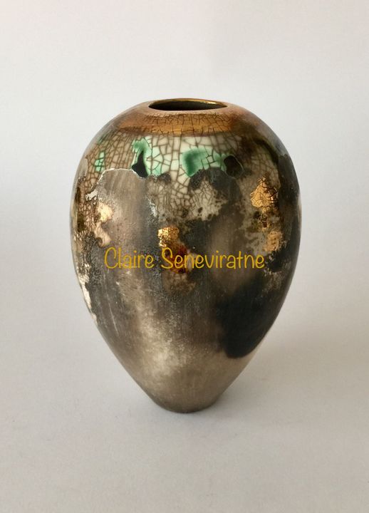 Medium smoke fired vessel with gold.