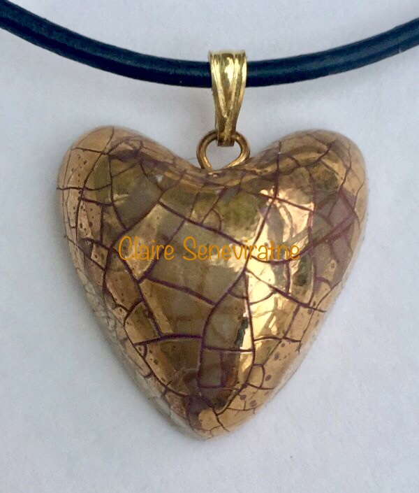 Gold heart pendant.