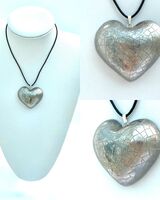 Large silver heart pendant.