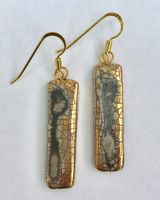 Gold rectangular ceramic earrings with crackled glaze.