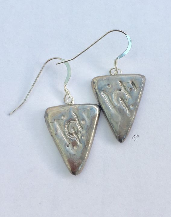 Silver triangle earrings.