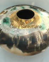 Large round smoke fired pot with gold lustre.