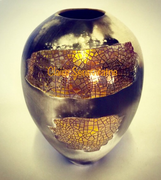 Small upright gold lustre smoke-fired porcelain pot.