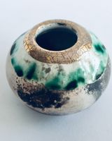 Small smoke fired pot with gold.