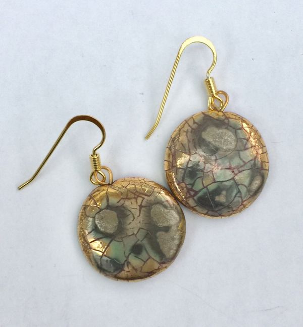 Round ceramic earrings with glaze and gold lustre.