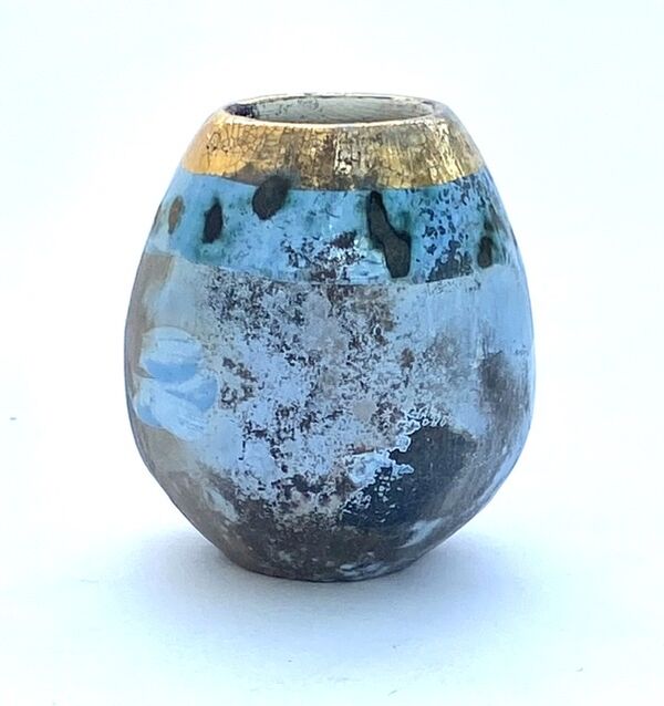 Small blue smoke-fired pot with gold lustre.