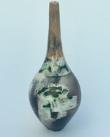 Ceramic pot, smoke-fired, with a long gold lustre neck.