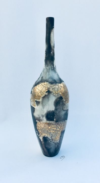 Smoke fired pot with long neck.