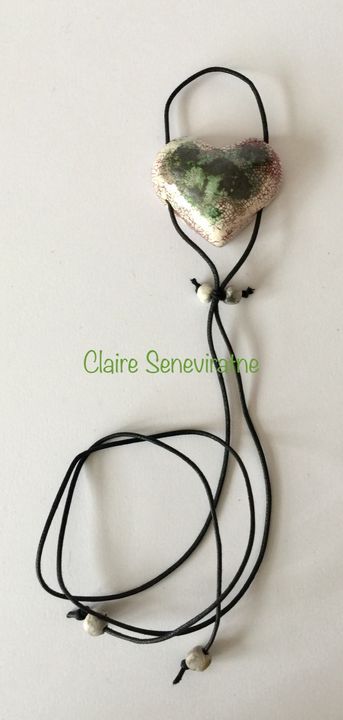 Heart pendant with black green and pink.