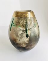 Sawdust fired ceramic pot partial glaze and gold lustre.