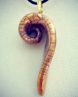 Gold lustre swirl pendant.