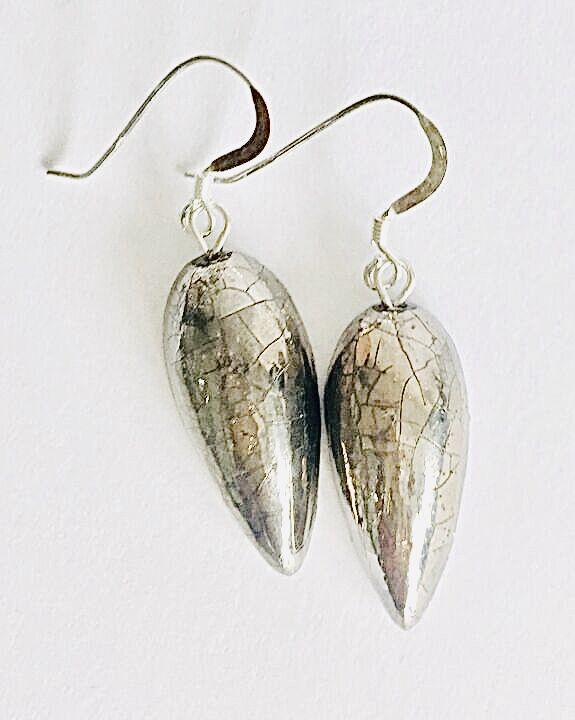 Silver teardrop ceramic earrings.