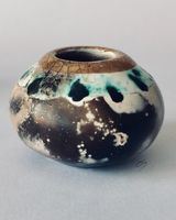 Small smoke fired pot with gold.