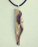 Silver lustre pendant.