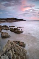 View across Dunraven Bay to Witches Point, dusk