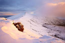 Cloud shrouds the summit of Pen Y Fan at dawn.