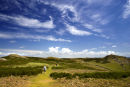 Walkers on Skomer Island under a crazy sky.